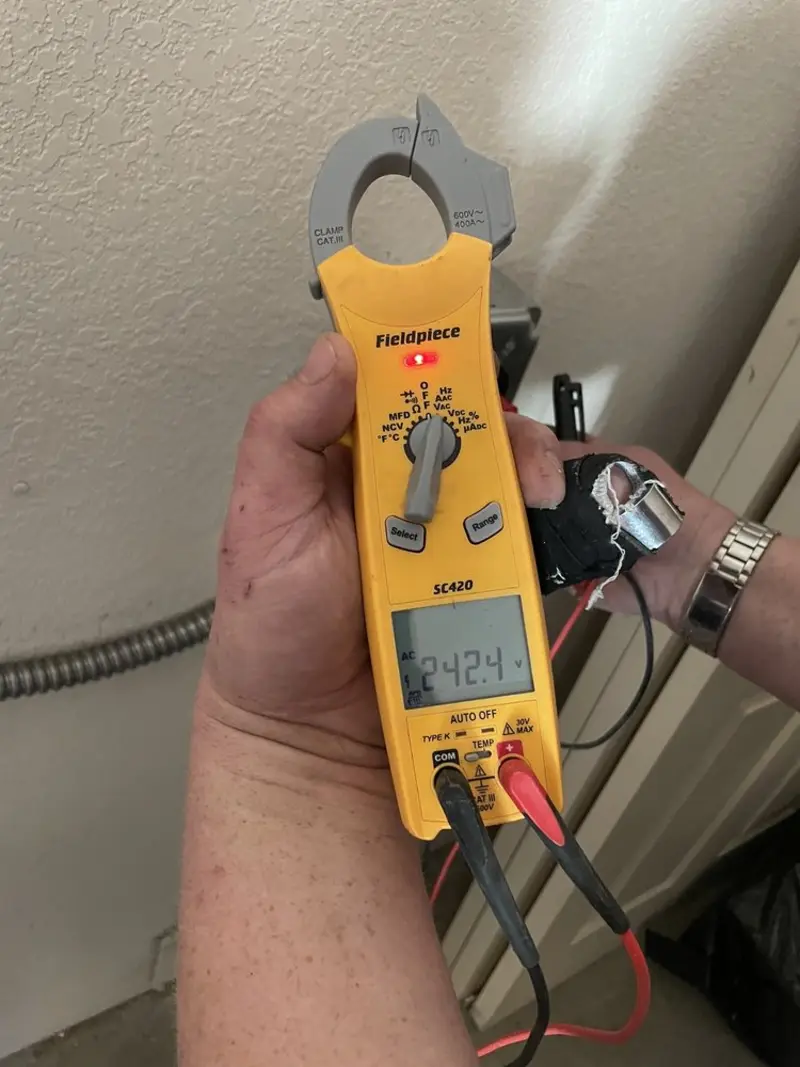 Voltage testing with clamp meter during Generator Installation in Westchase